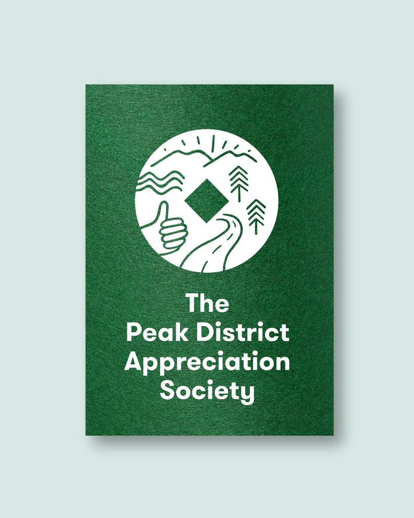 Green Paper with White Ink, featuring a circular peak district drawing and text saying the peak district appreciation society.