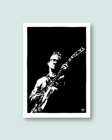 Framed black and white artwork of Richard Hawley playing guitar on a light gray background
